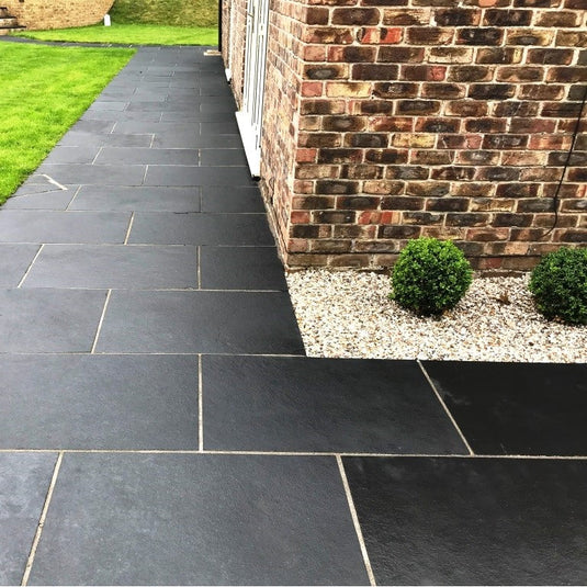 Kota Black Limestone Paving - 900 x 600 x 22mm - Sawn & Riven